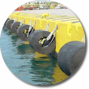lots of cylindrical fenders are installed at dock.