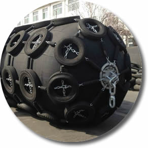 bigger pneumatic fender with protective tire is on ground.