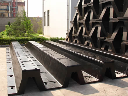 Several black improved super arch fenders are placed in the factory.